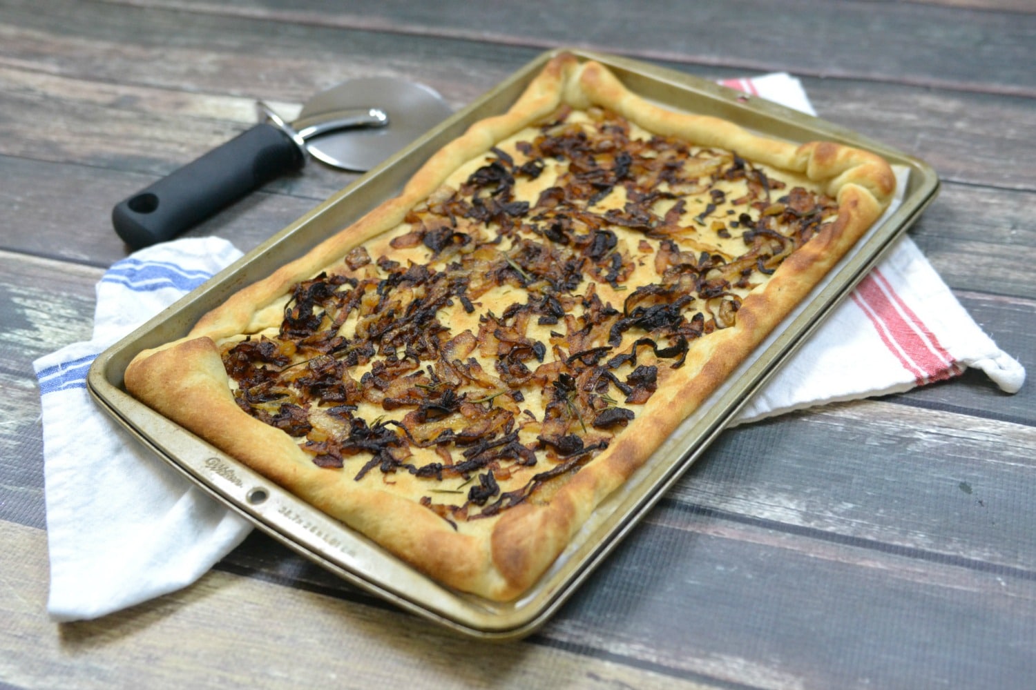 Bake caramelized onion flatbread until lightly browned. 