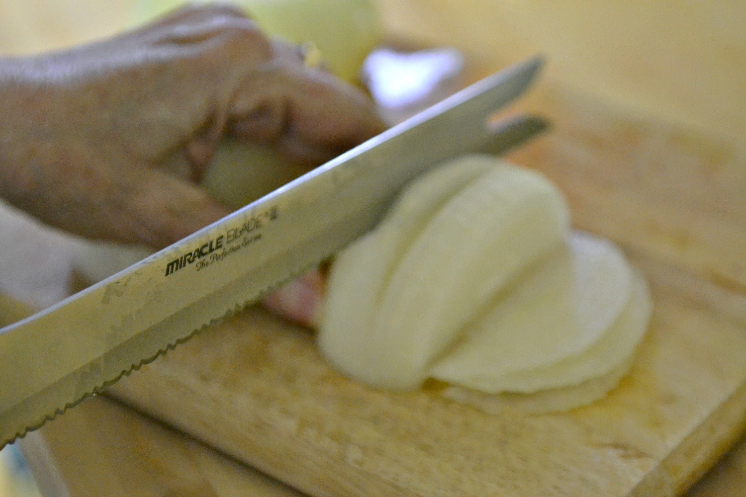 Remove outer layers from onions, cut in half then into thin slices.