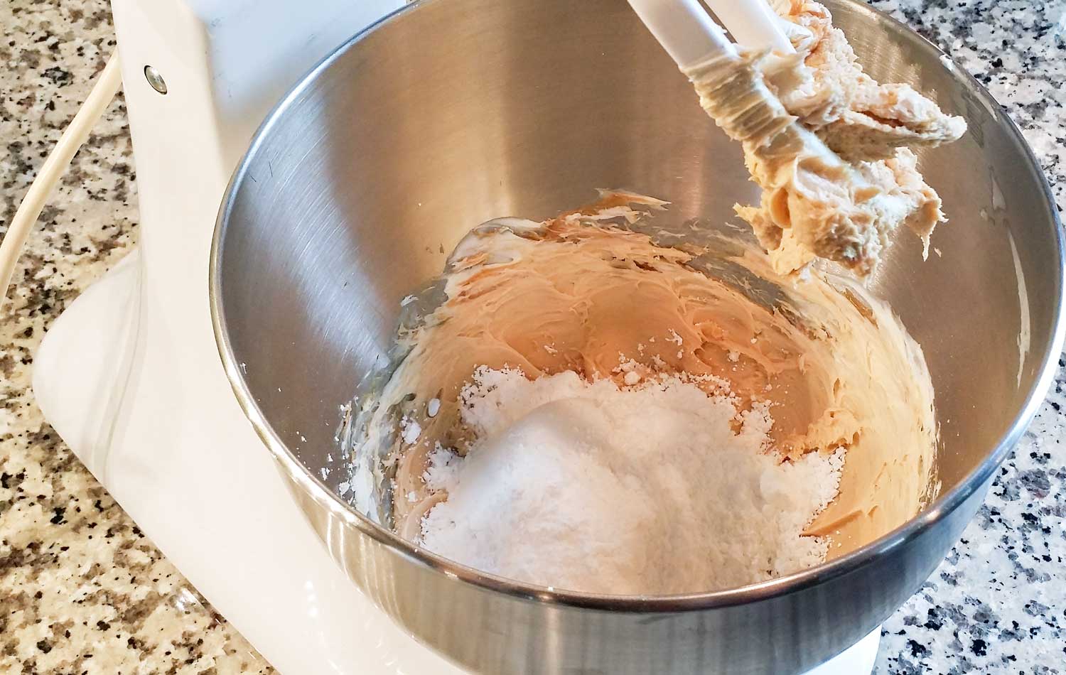 Mix peanut butter, cream cheese and coffee creamer until combined then add in confectioners sugar. 