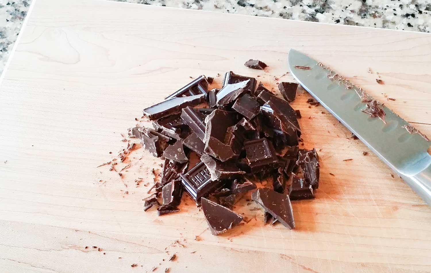 Chop chocolate into small pieces using a knife. 