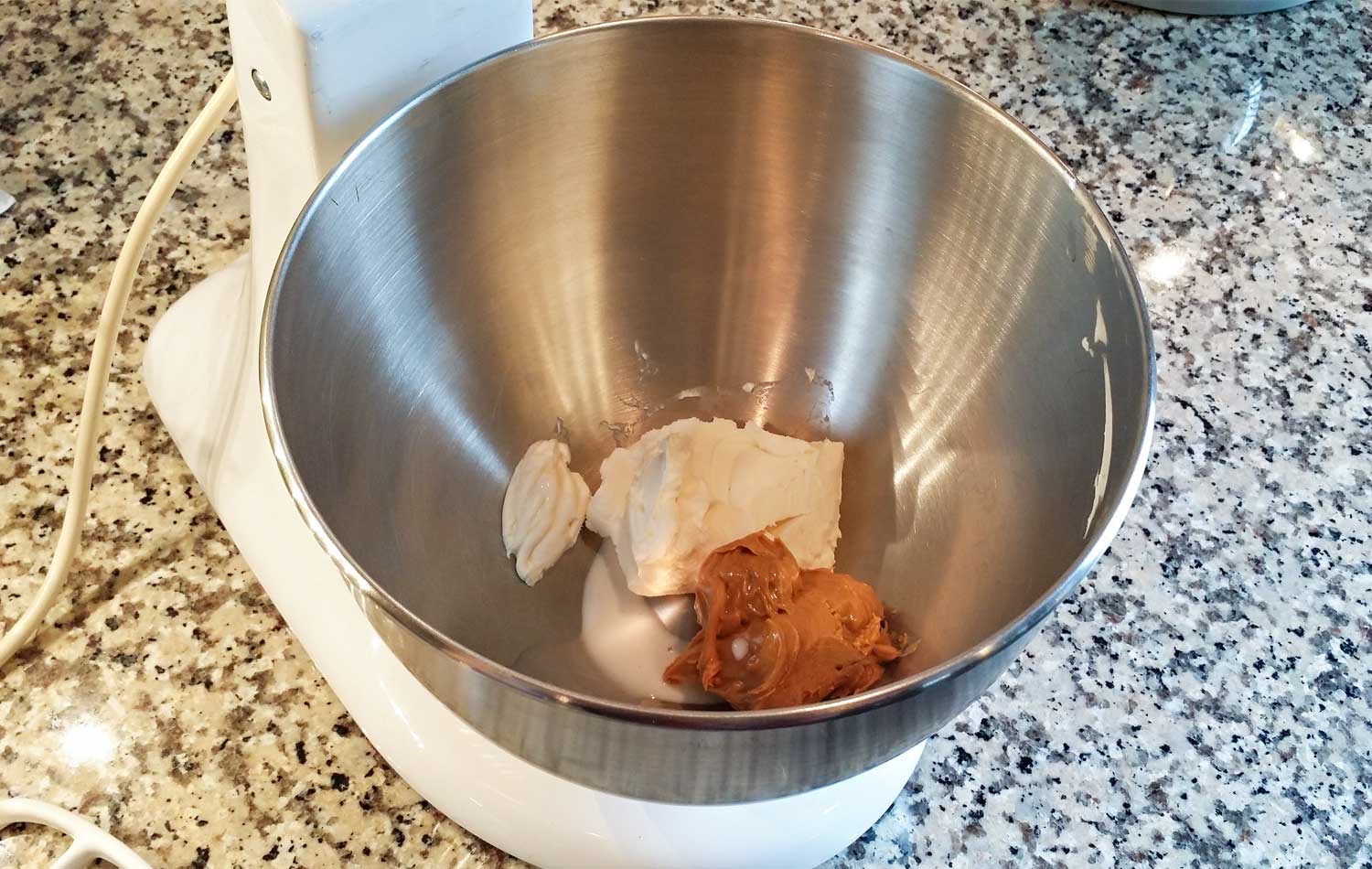 Combine coffee creamer, peanut butter and cream cheese in mixer bowl. 