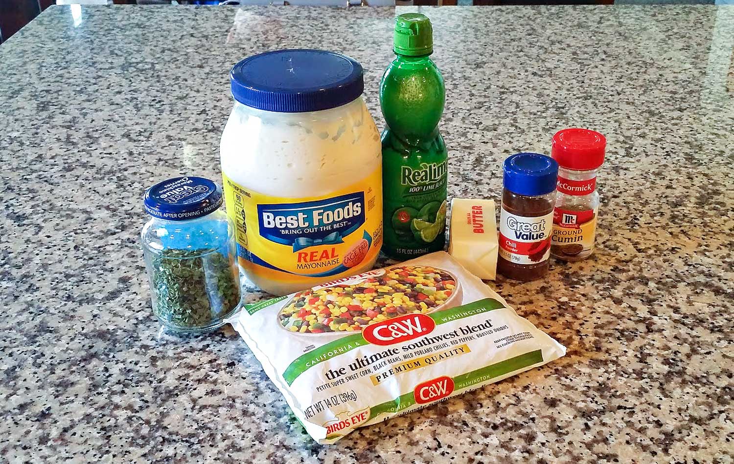 Assemble your ingredients: Ultimate Southwest Blend frozen pack (contains corn, black beans, chilies, red peppers & roasted onions), butter, chili powder, cumin, mayonnaise, lime juice, chives, salt and pepper