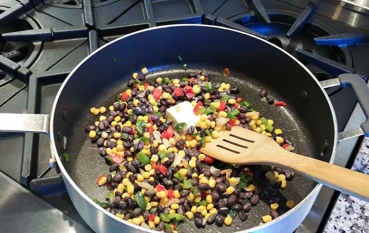 Combine corn blend, butter and seasonings in a large skillet and saute.