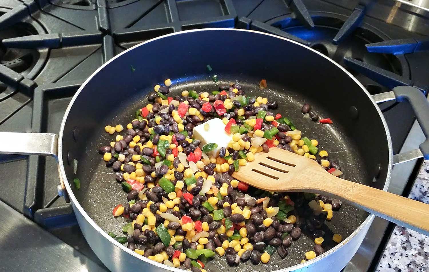 Combine corn blend, butter and seasonings in a large skillet and saute. 