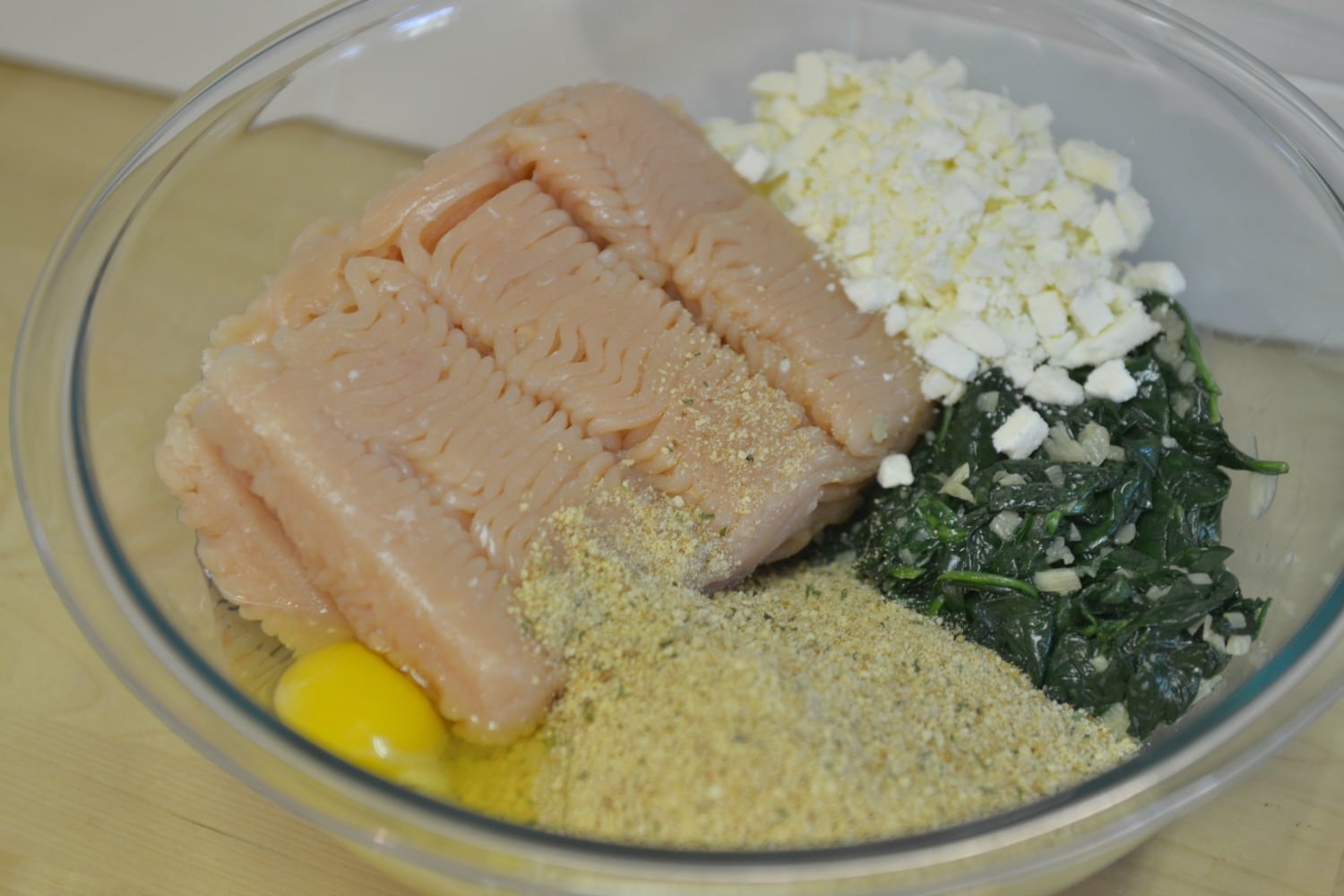 Combine the turkey, egg, breadcrumbs, spinach and feta in a bowl. 