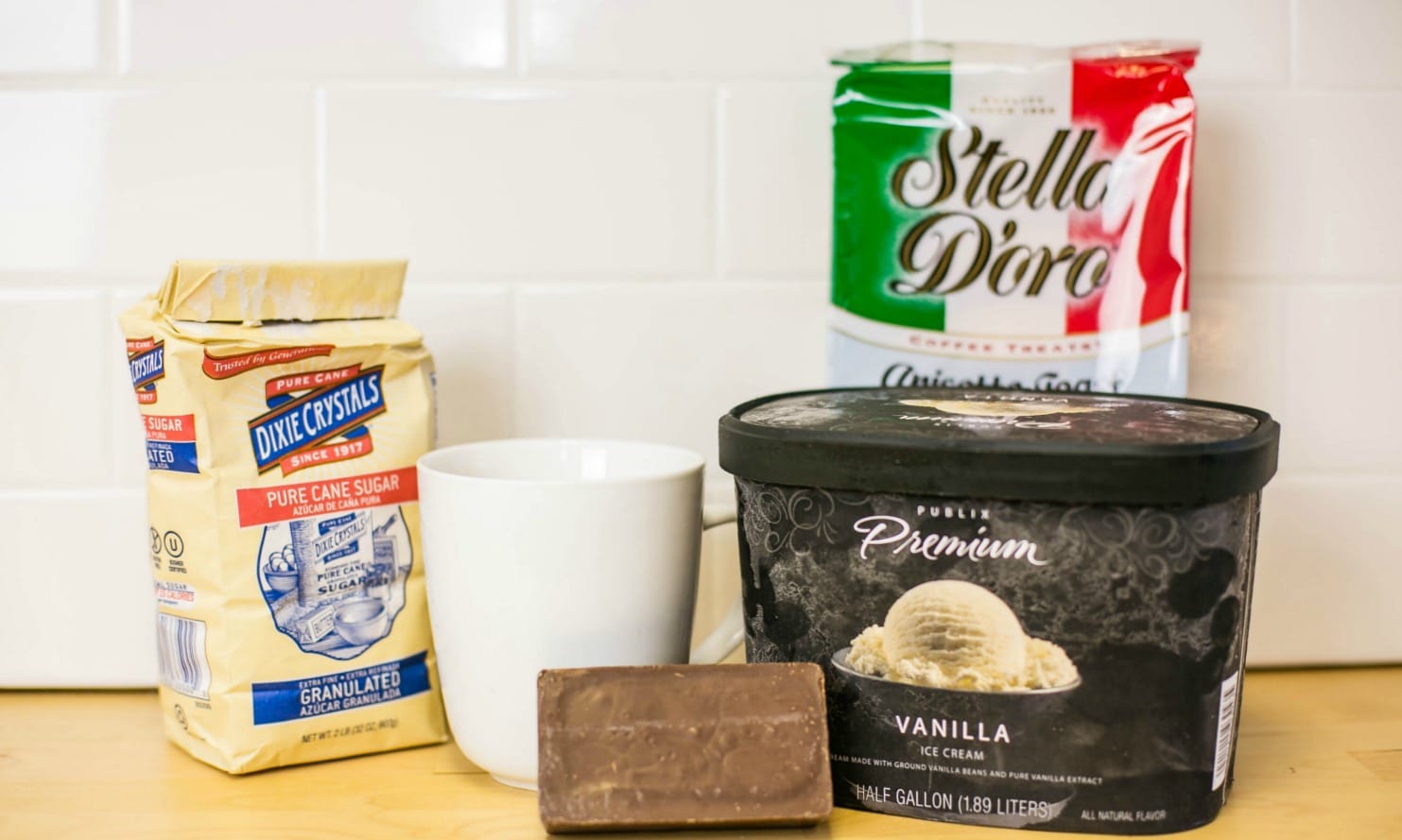 Assemble your coffee cookie ice cream ingredients: sugar, coffee, vanilla ice cream, and Italian toast cookies. 