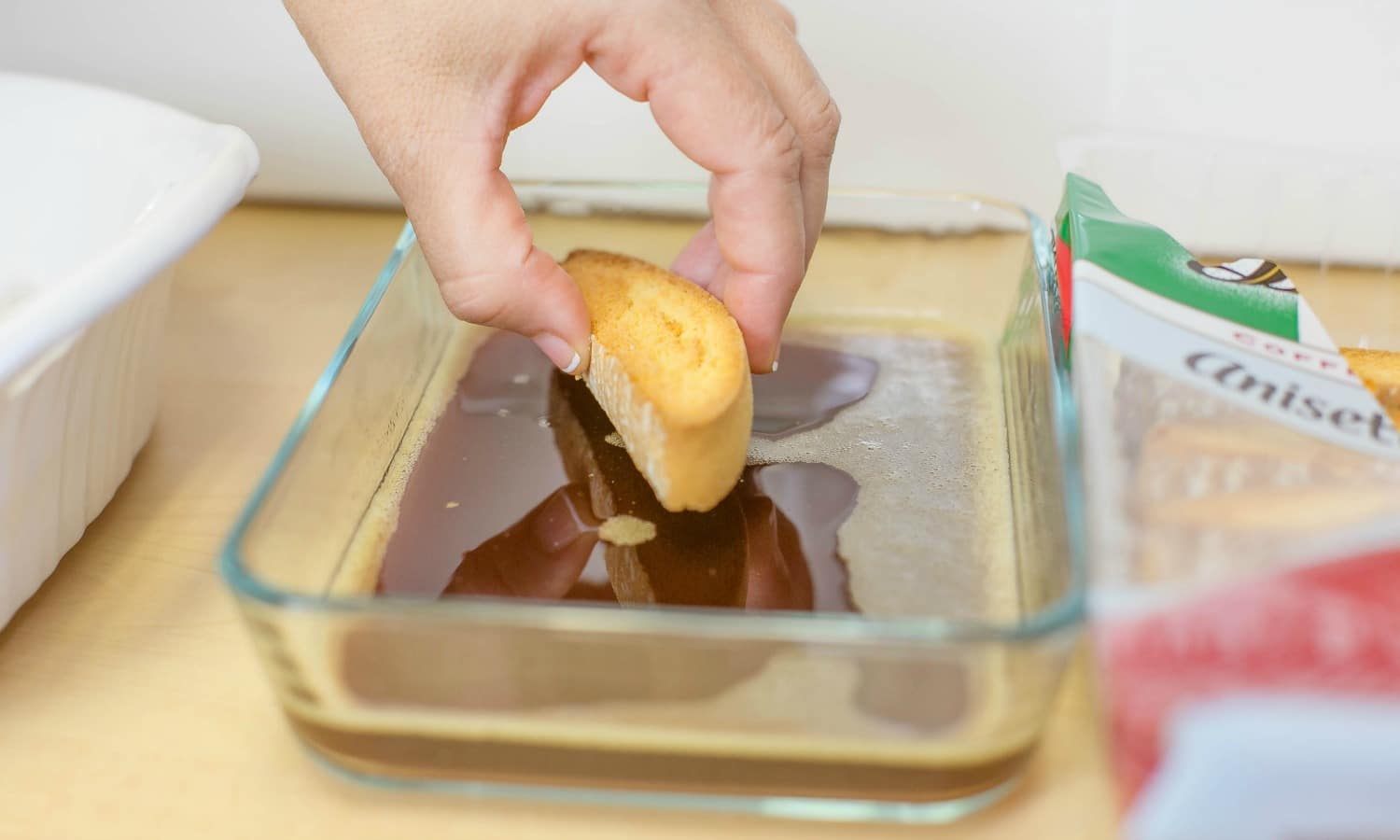 Dip the cookies into the coffee mixture one at a time.