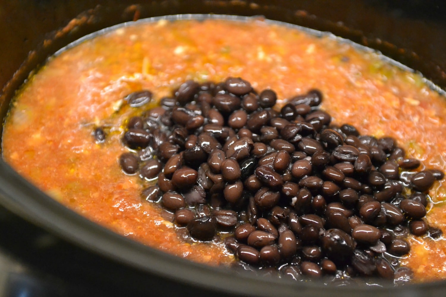 Add black beans to salsa mixture in crock pot. 