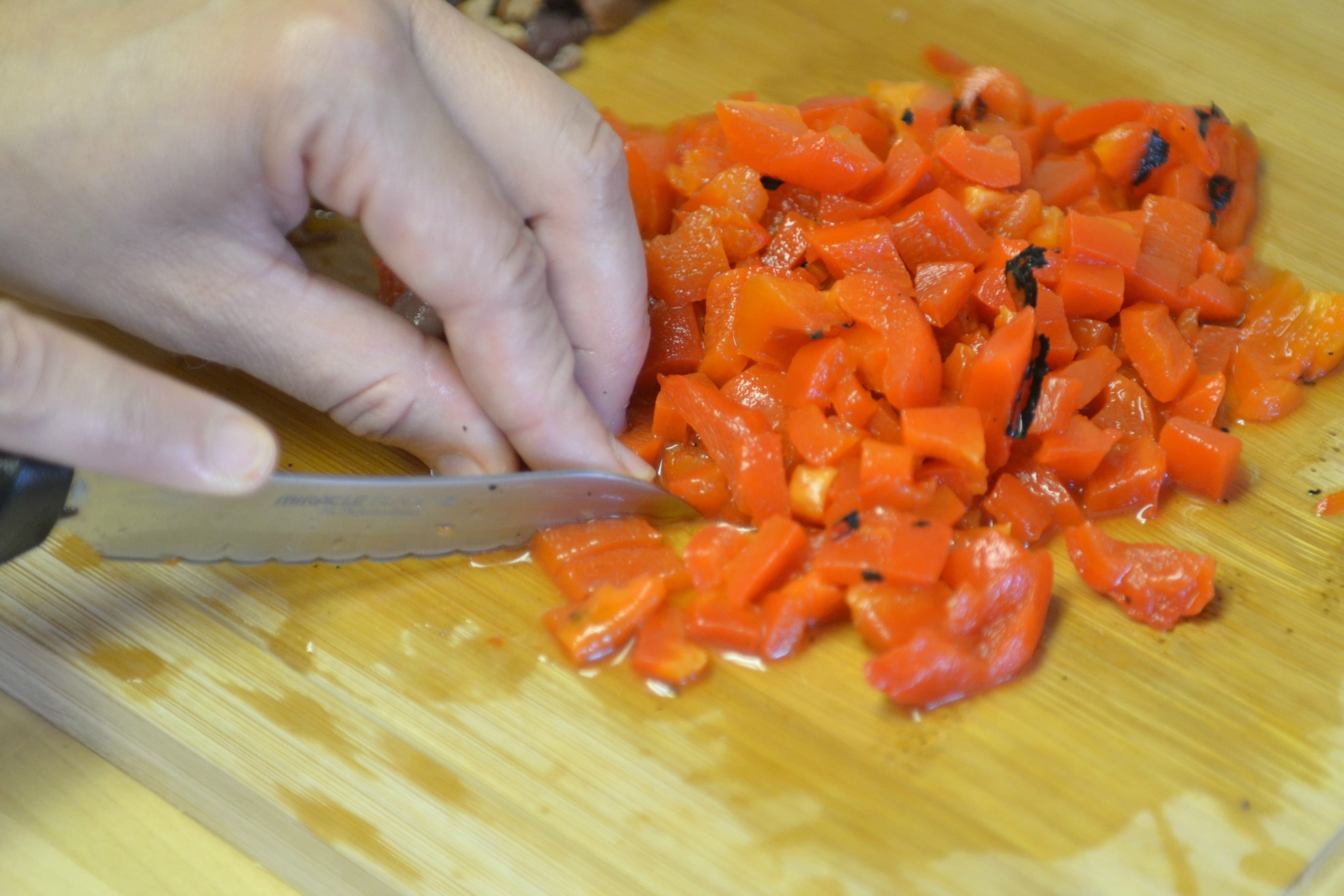 Chop the roasted red peppers into small pieces. 