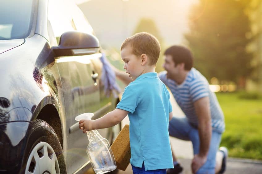 Give your kids confidence by letting them assist with activities like cleaning the car. 