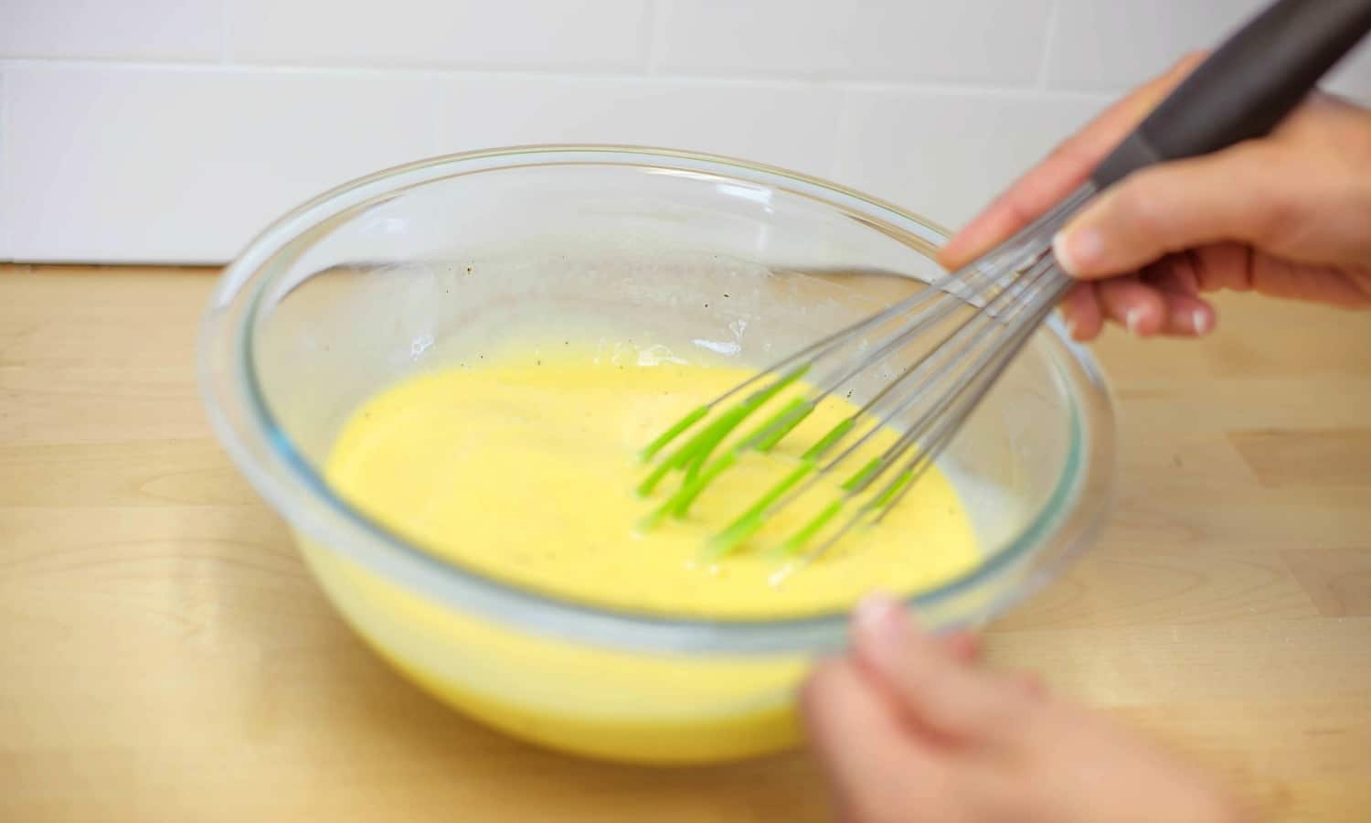Season and whisk eggs in a bowl