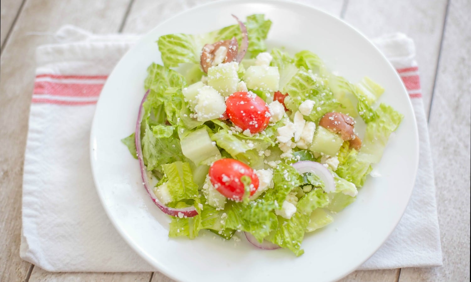 Add feta to top of salad and serve.