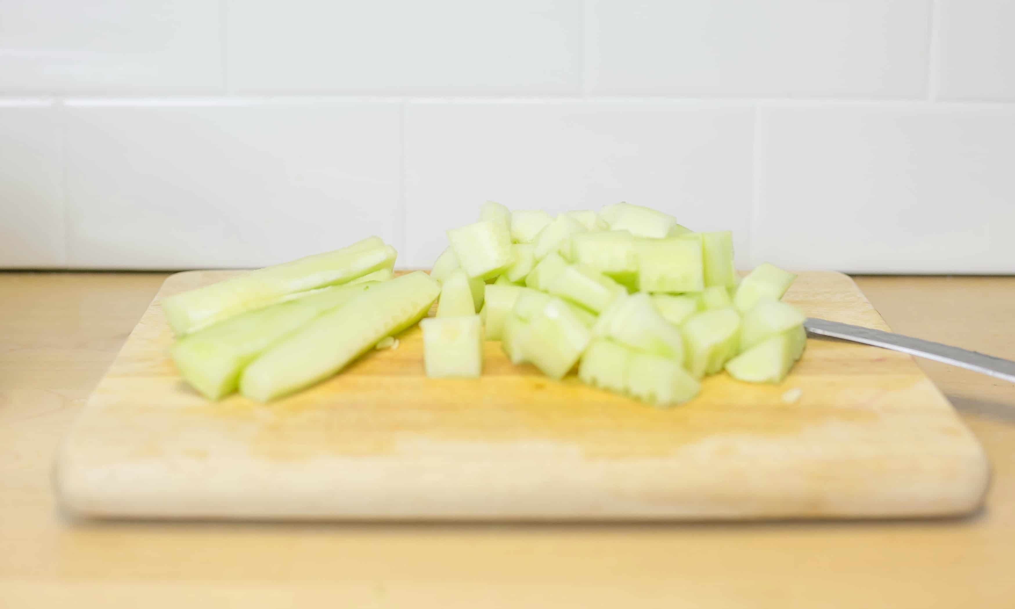 Peel cucumber, seed it and chop then set aside.