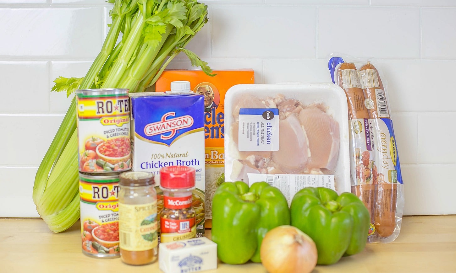 Assemble the jambalaya ingredients: chicken, sausage, celery, tomatoes, peppers, onions, rice and seasonings. 