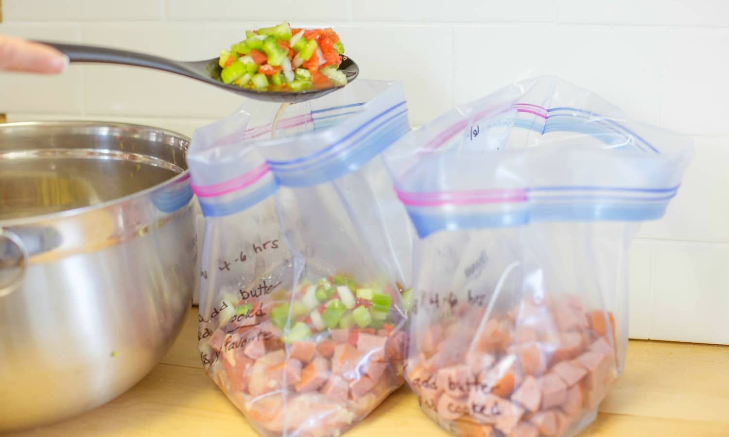 Spoon the chicken, sausage and vegetables into freezer bags to store. 