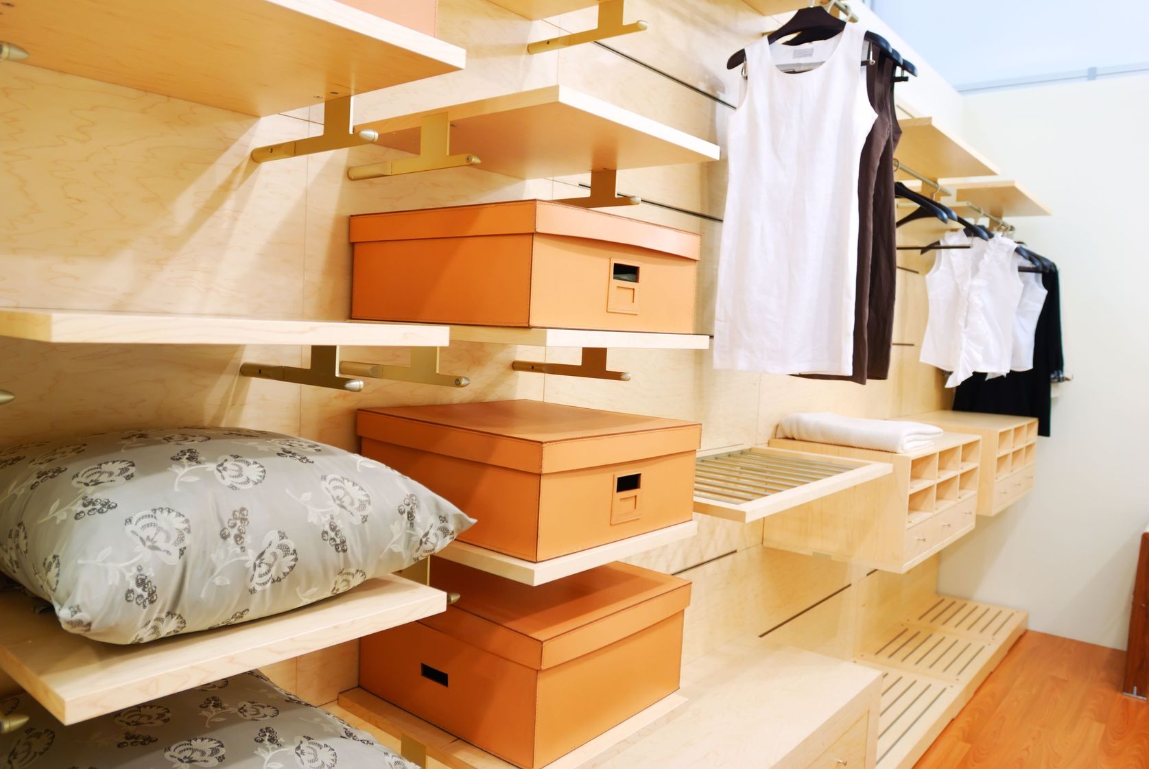 This organized closet is tidy and has lots of storage. 