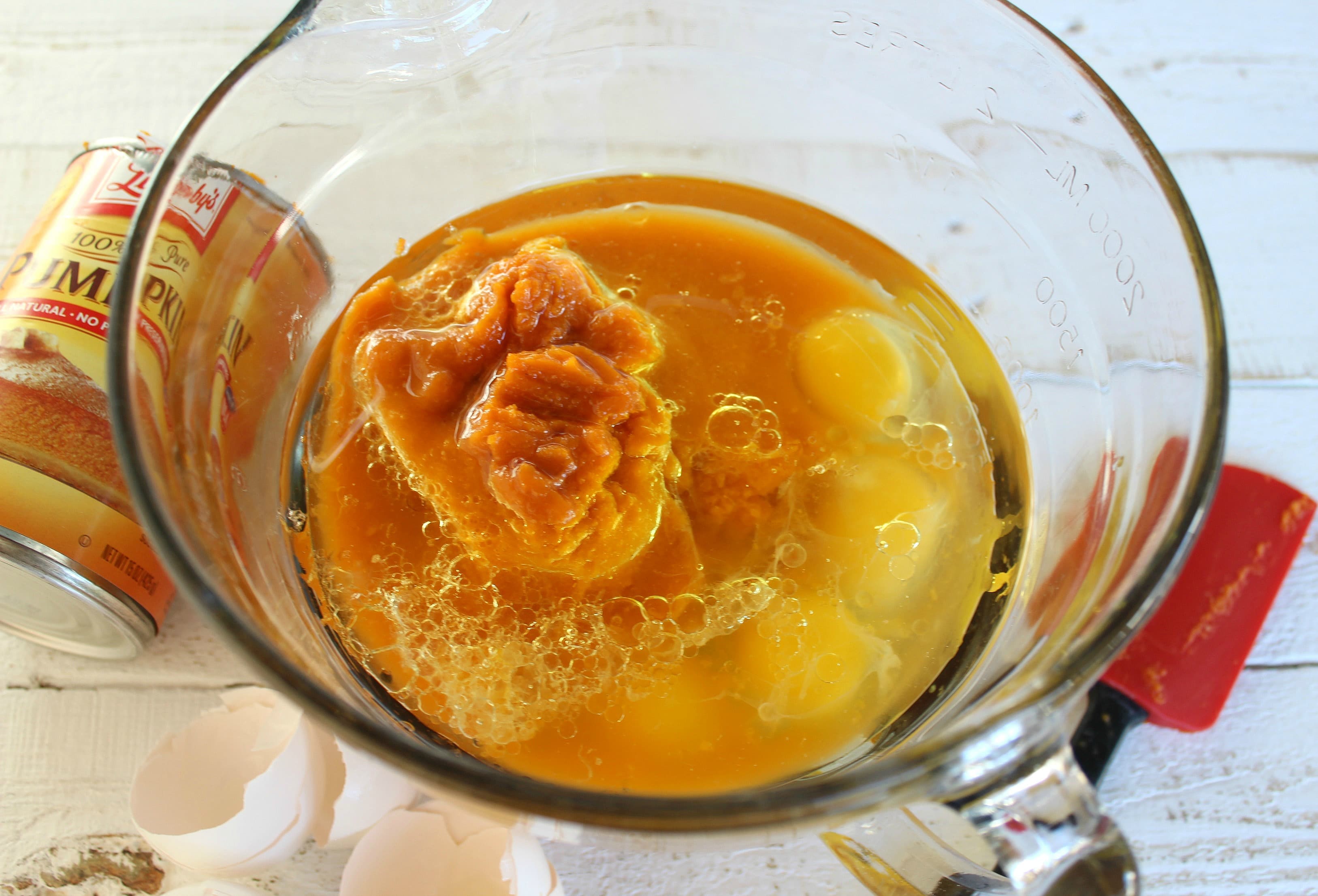 Combine the pumpkin and eggs in a bowl and mix the wet ingredients together. 