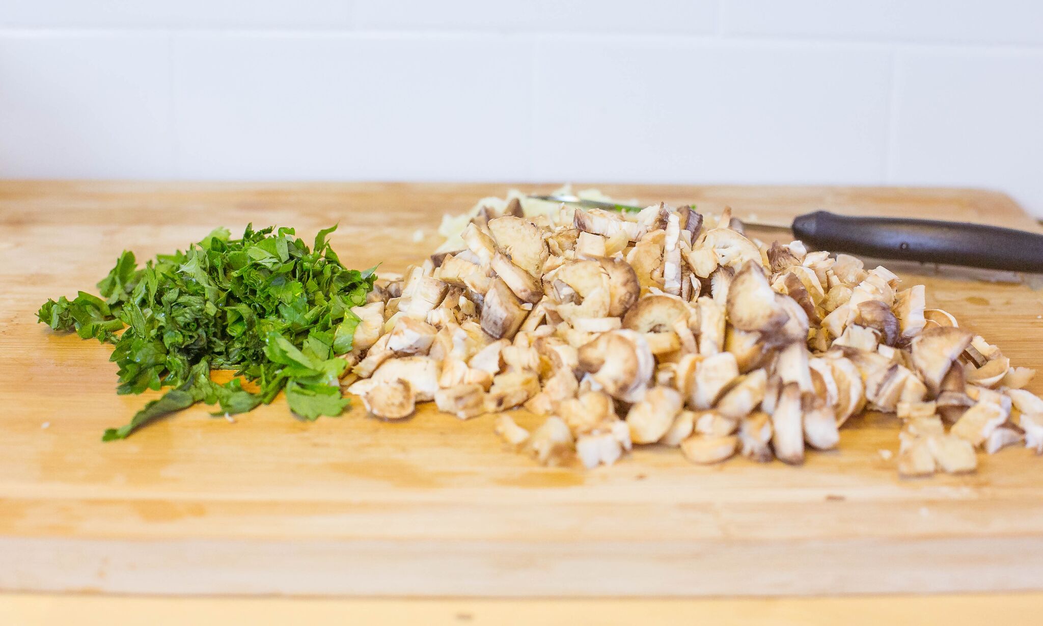 Chop garlic, parsley, and mushrooms. 