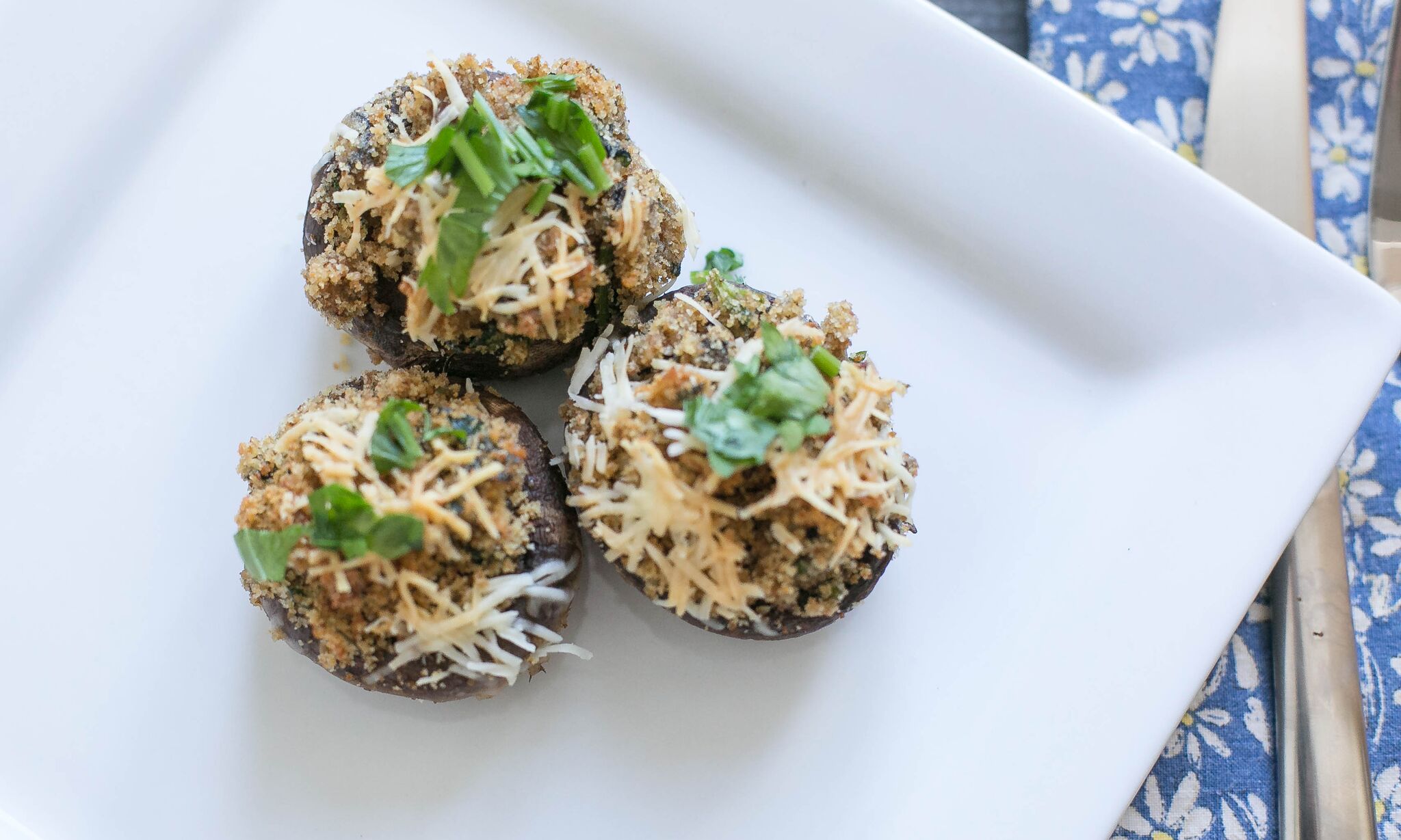 Serve these easy stuffed mushrooms garnished with parsley and fresh parmesan cheese. 