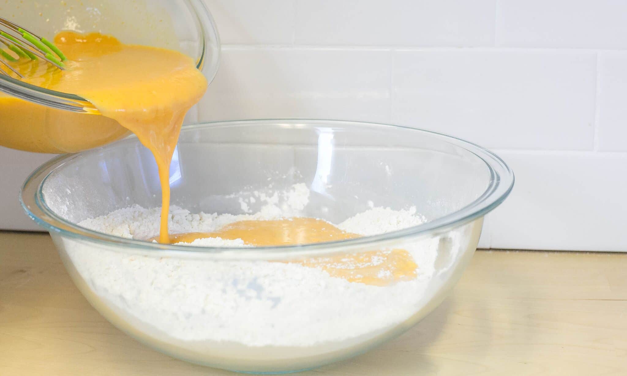 Add liquid mixture to dry ingredients, stirring lightly with wire whisk until batter is combined.
