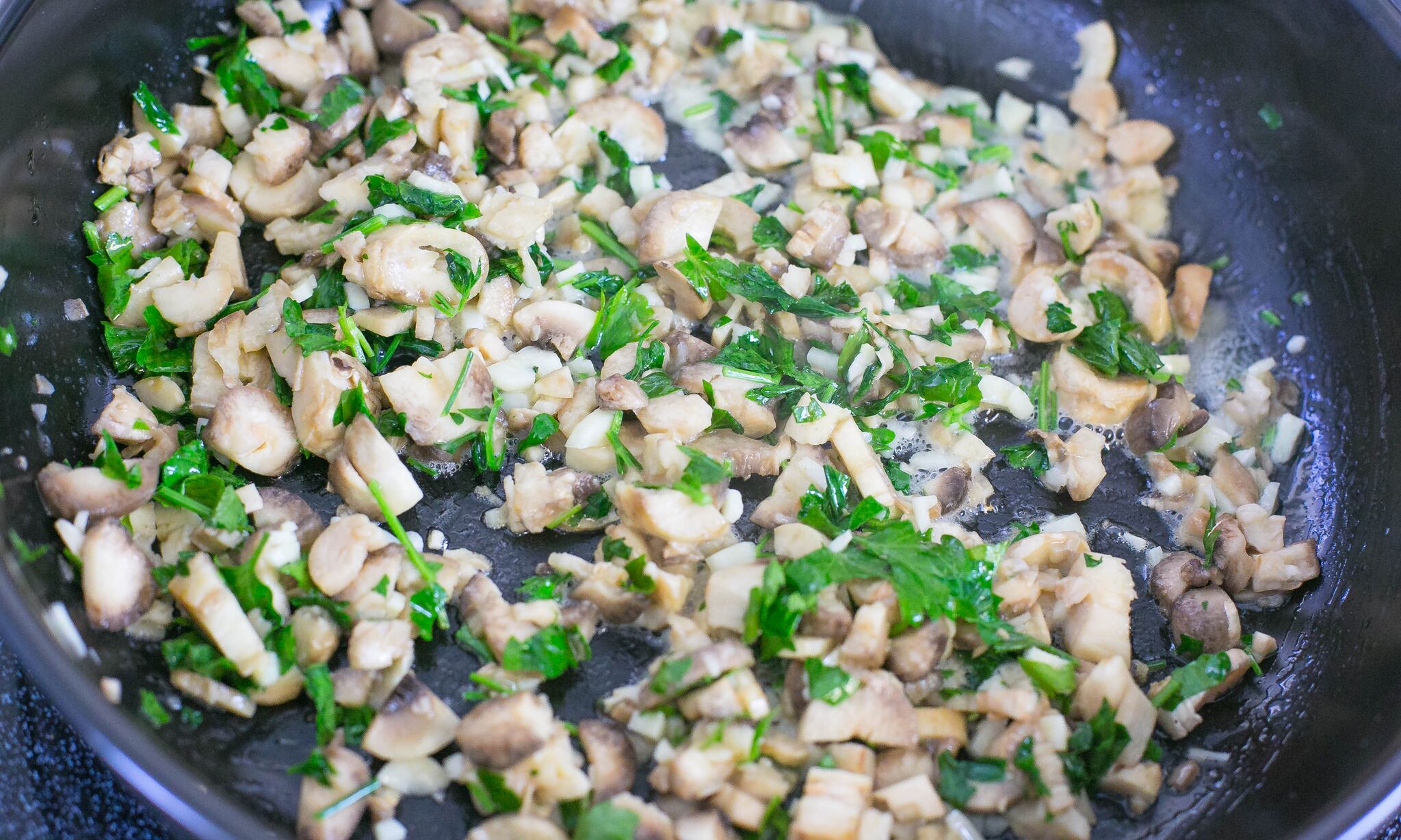 Saute mushrooms and herbs in butter until the mushrooms are soft. 