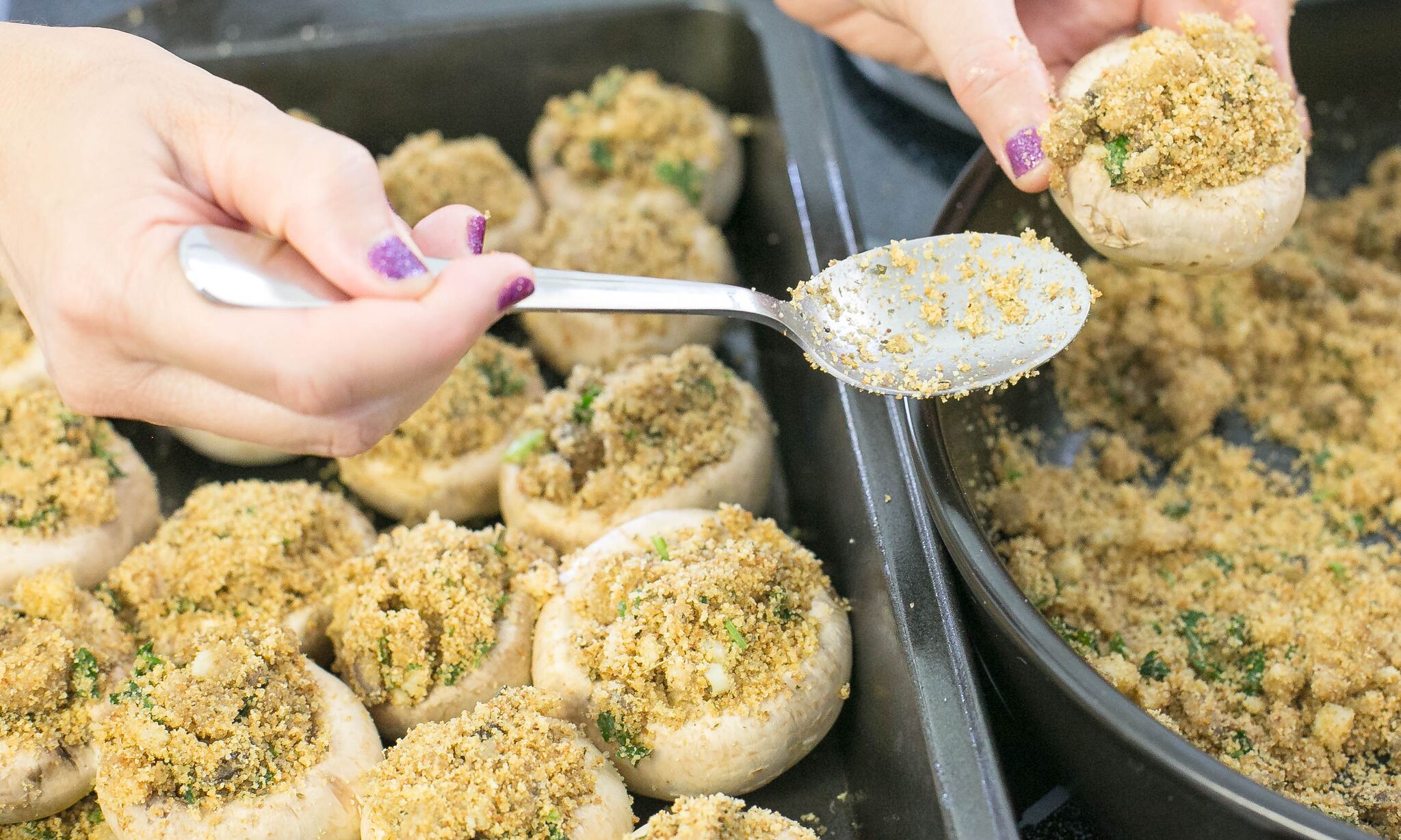 Spoon breadcrumb and mushroom mixture into mushrooms and place in baking tray. 