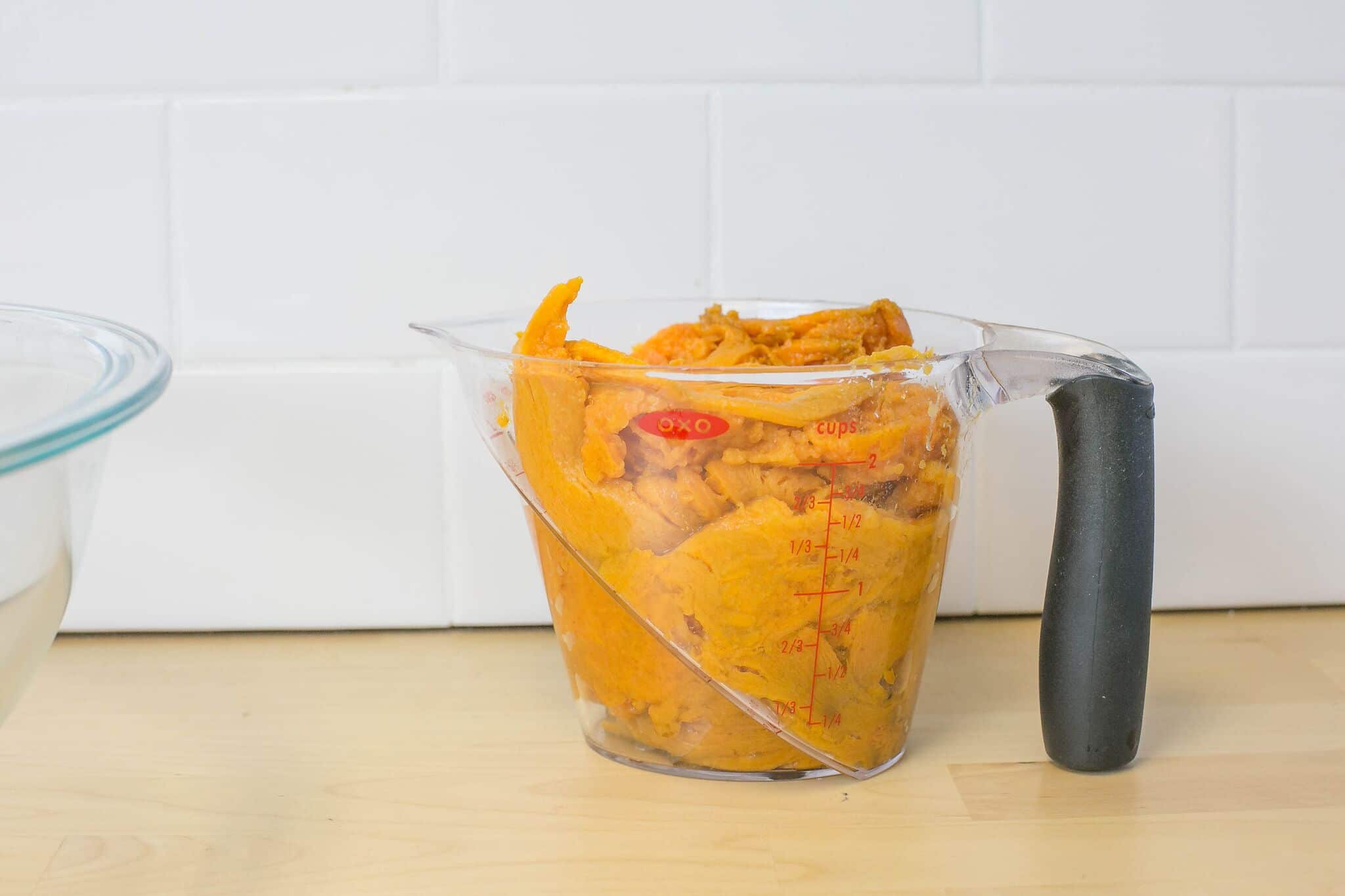 Placed cooled, mashed sweet potatoes into large measuring cup. 