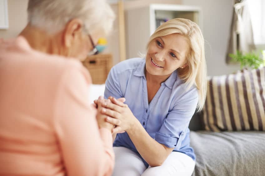 It's important to stay calm and smile when talking to your aging parents about money. 