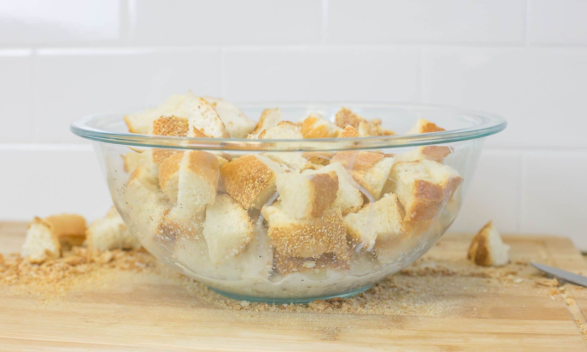 Cube bread; and add to bowl of milk seasoned with salt and pepper.