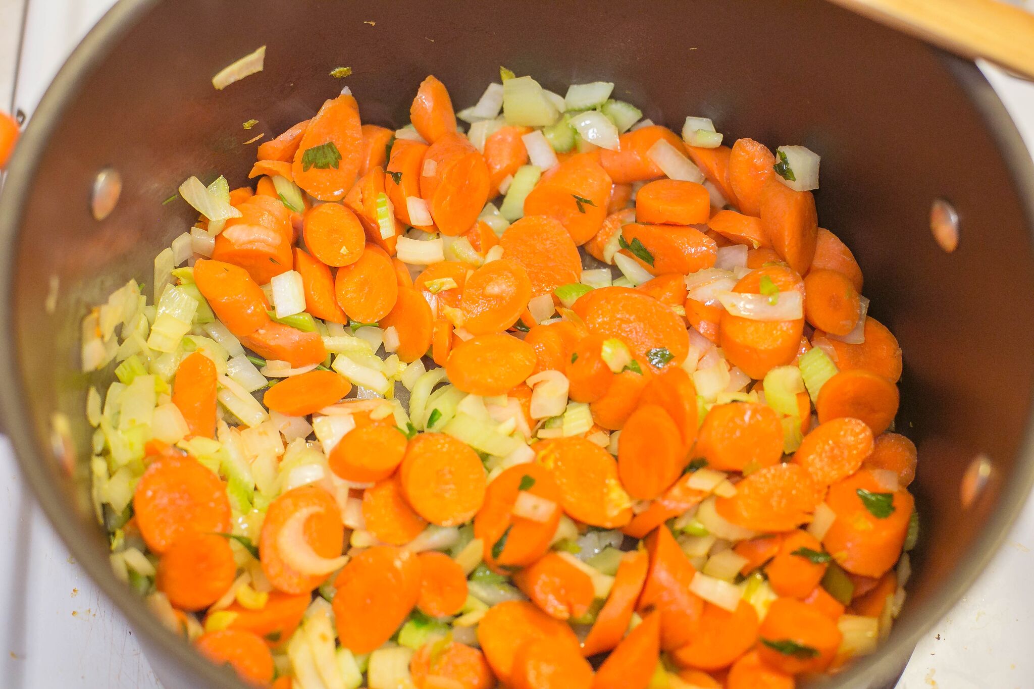 Turkey & Rice Soup | Saute vegetables in a pot with olive oil.