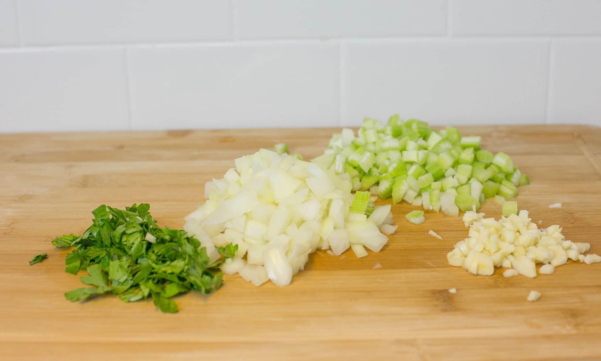 Chop onions, celery, parsley and garlic; set aside.