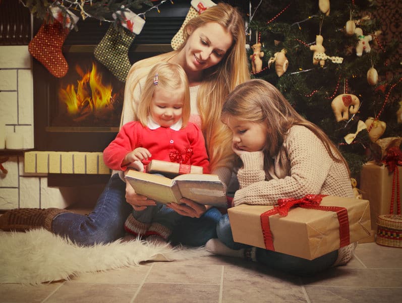 Sharing some christmas stories around the tree is a great way to spend time together as a family