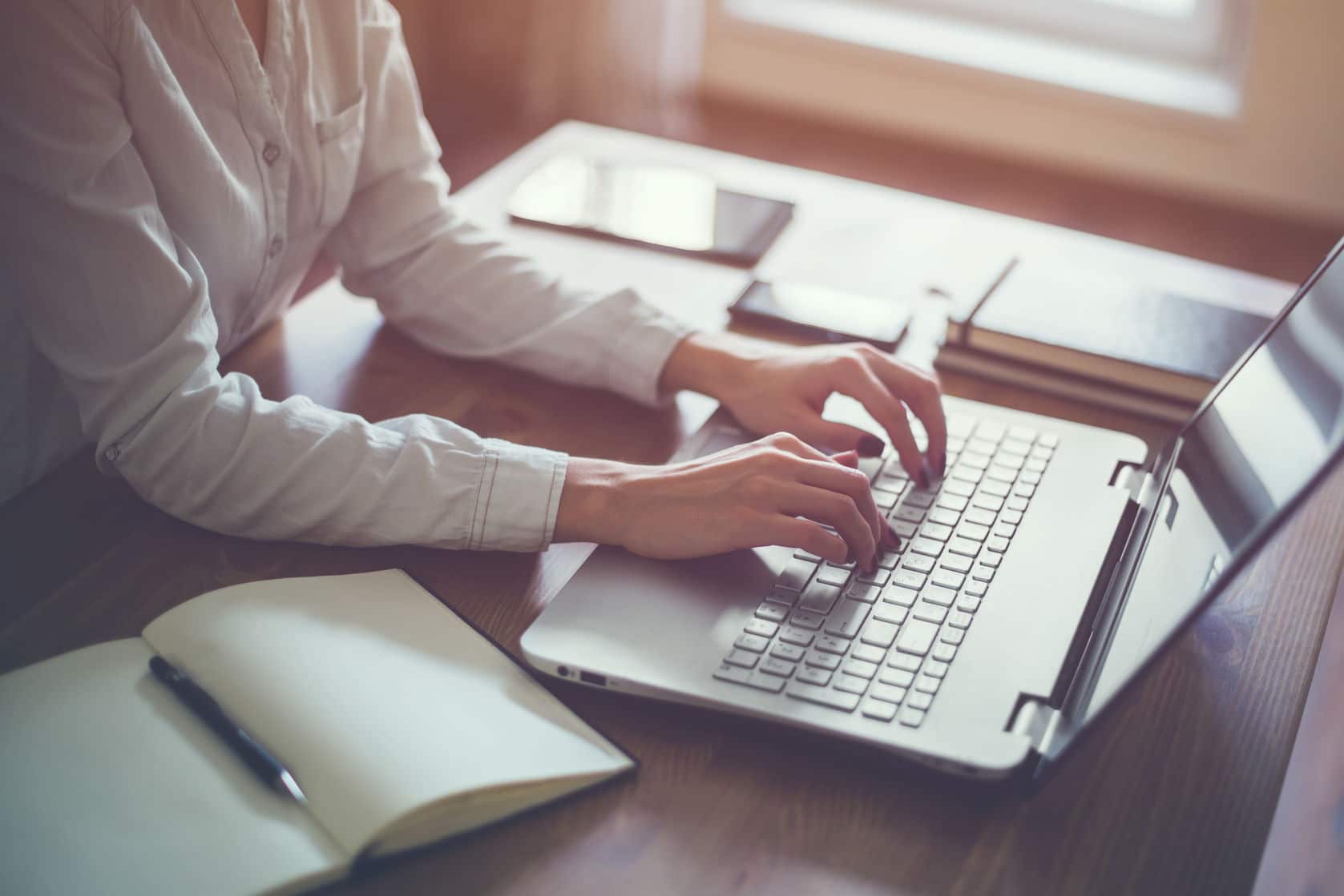 A woman doing work on her laptop. 