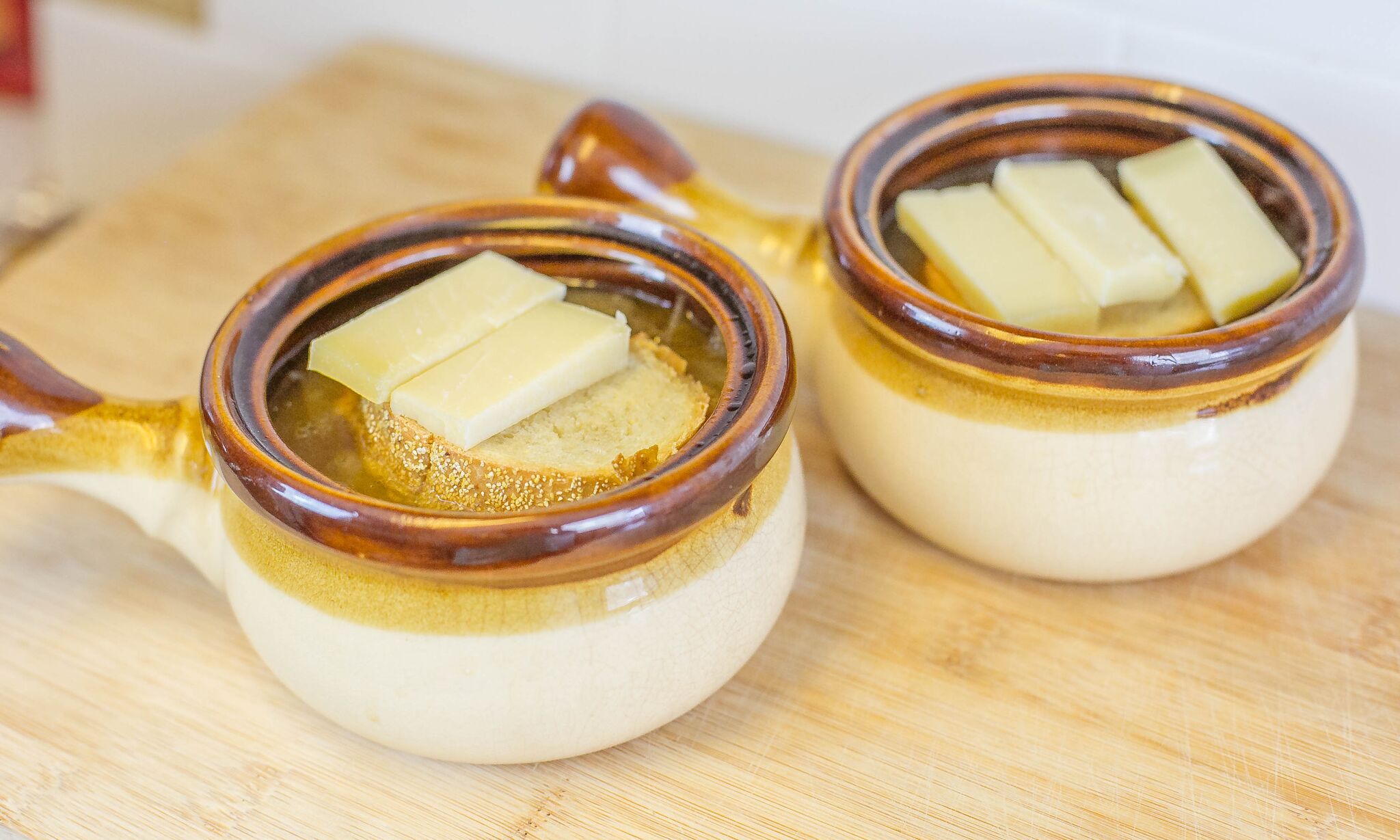 Serve french onion soup with bread and cheese
