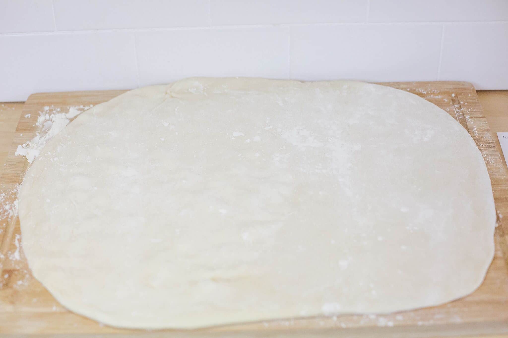 Flour your wooden cutting board and roll out dough. 