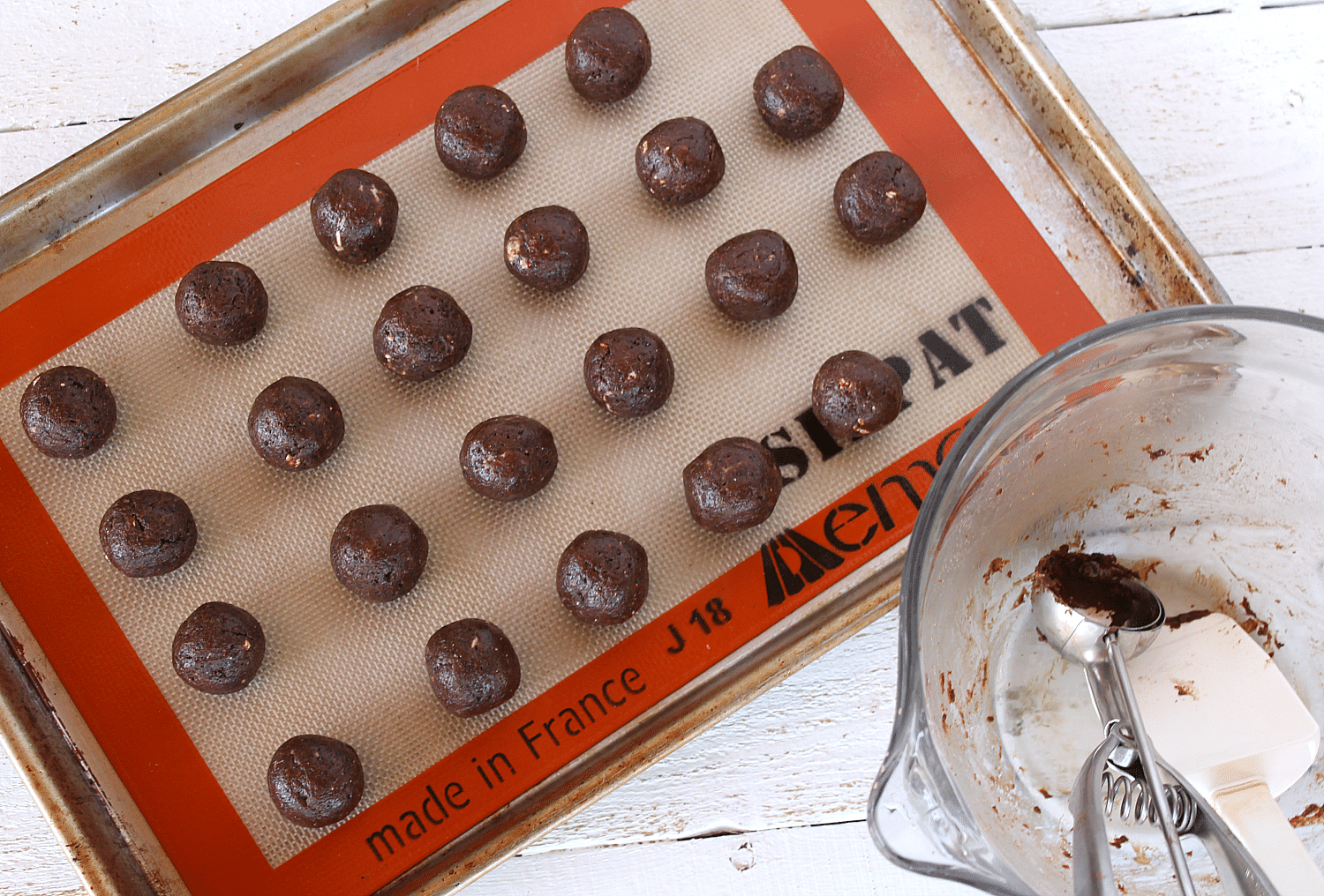 Roll mixture into balls and place on a baking sheet lined with a Silpat liner.