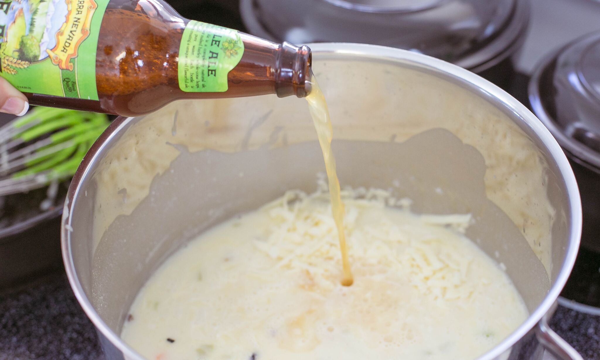 Add the shredded cheddar and beer to pot. 