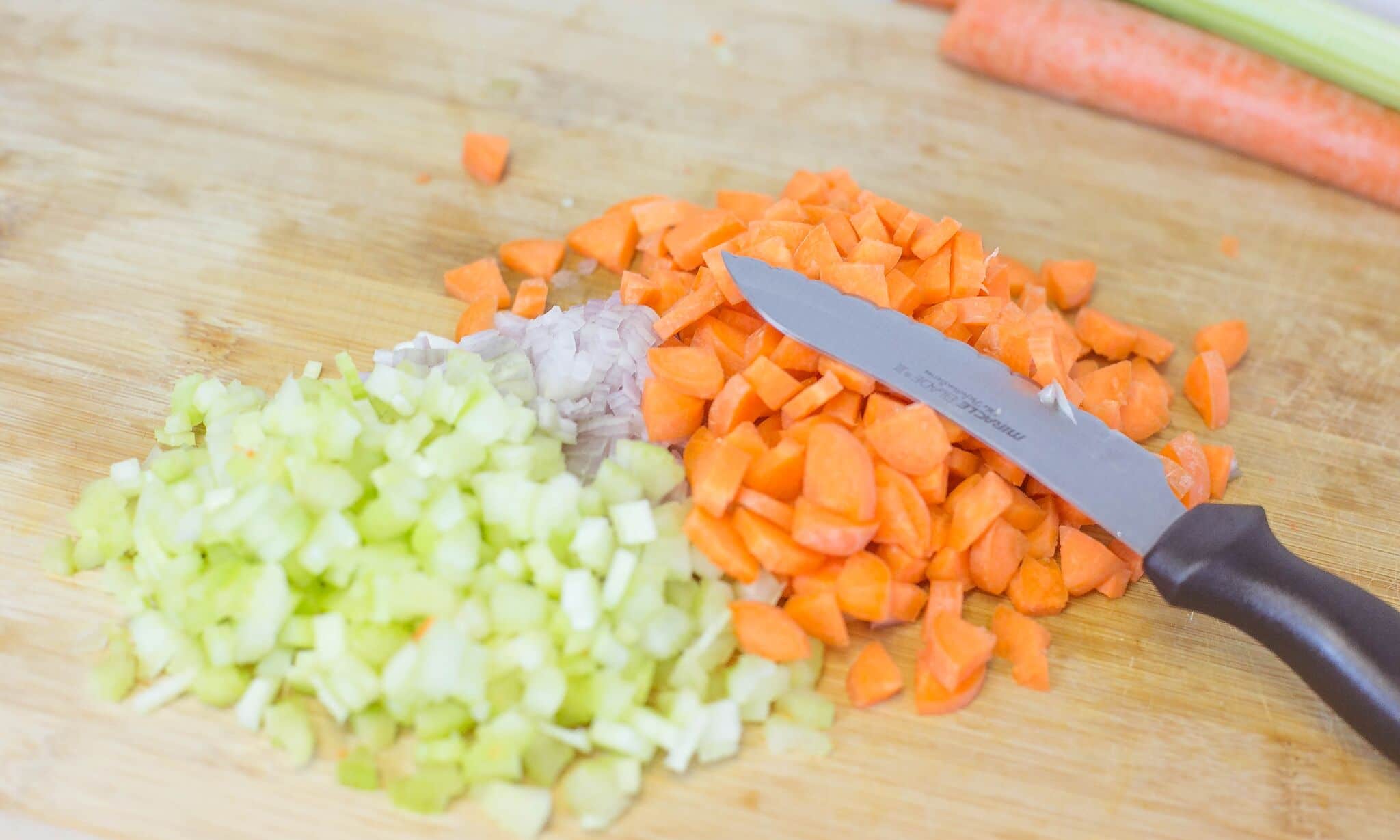 Chop shallots, celery and carrots. 