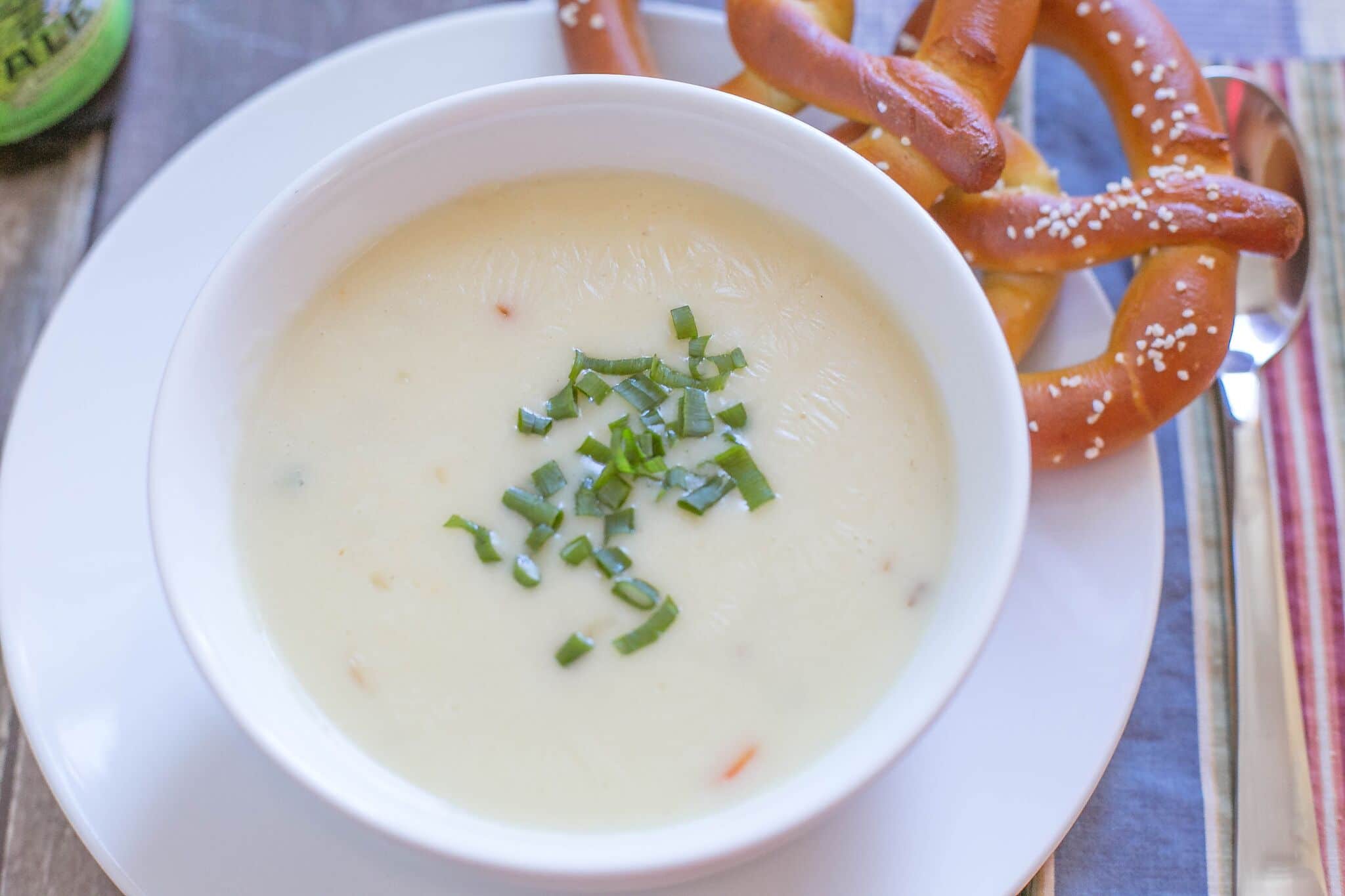 Once cooked, spoon into bowls and serve hot with warm soft pretzels.
