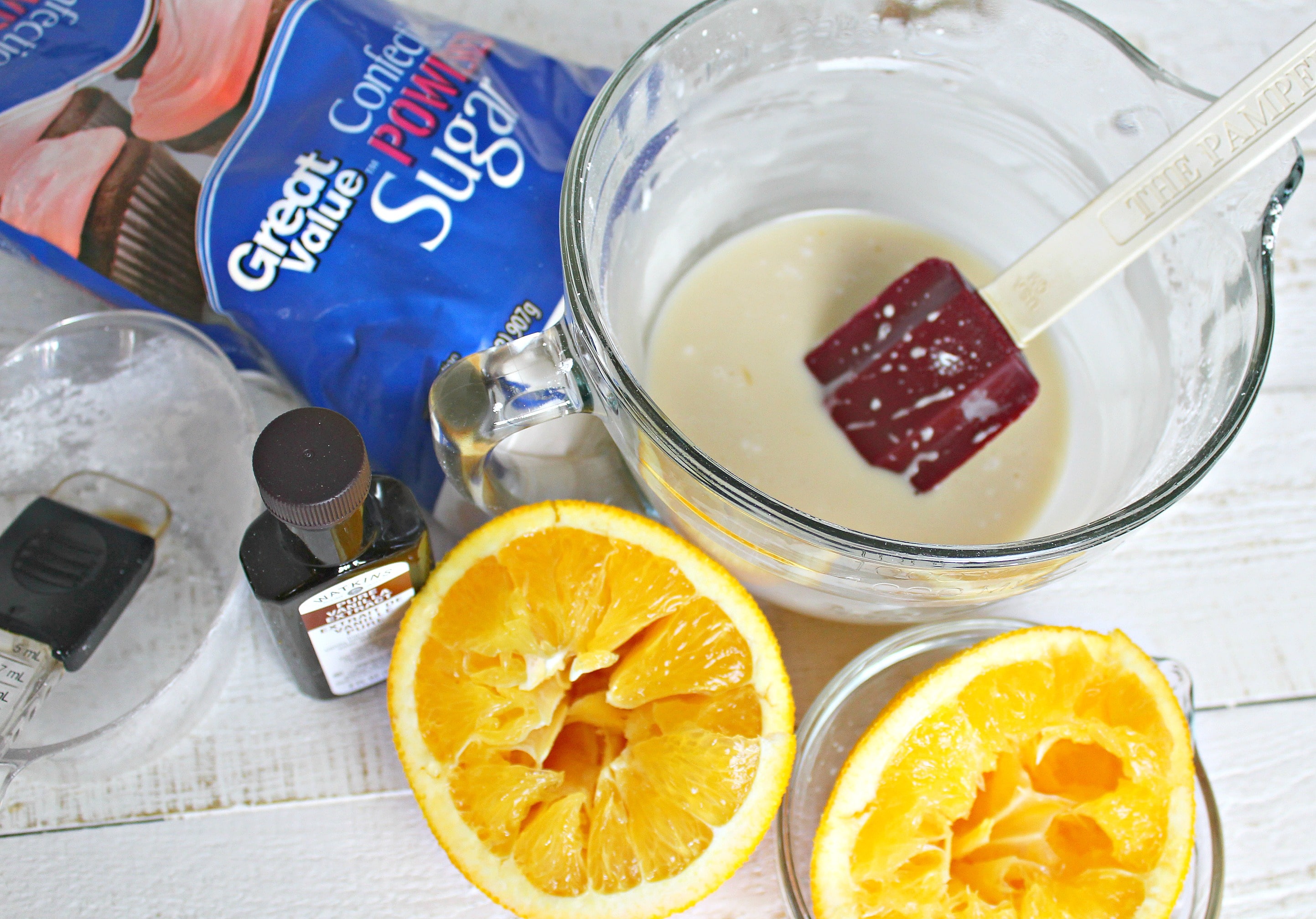 To make the syrup, add the powdered sugar, vanilla, and fresh squeezed orange juice to a bowl and whisk together. 