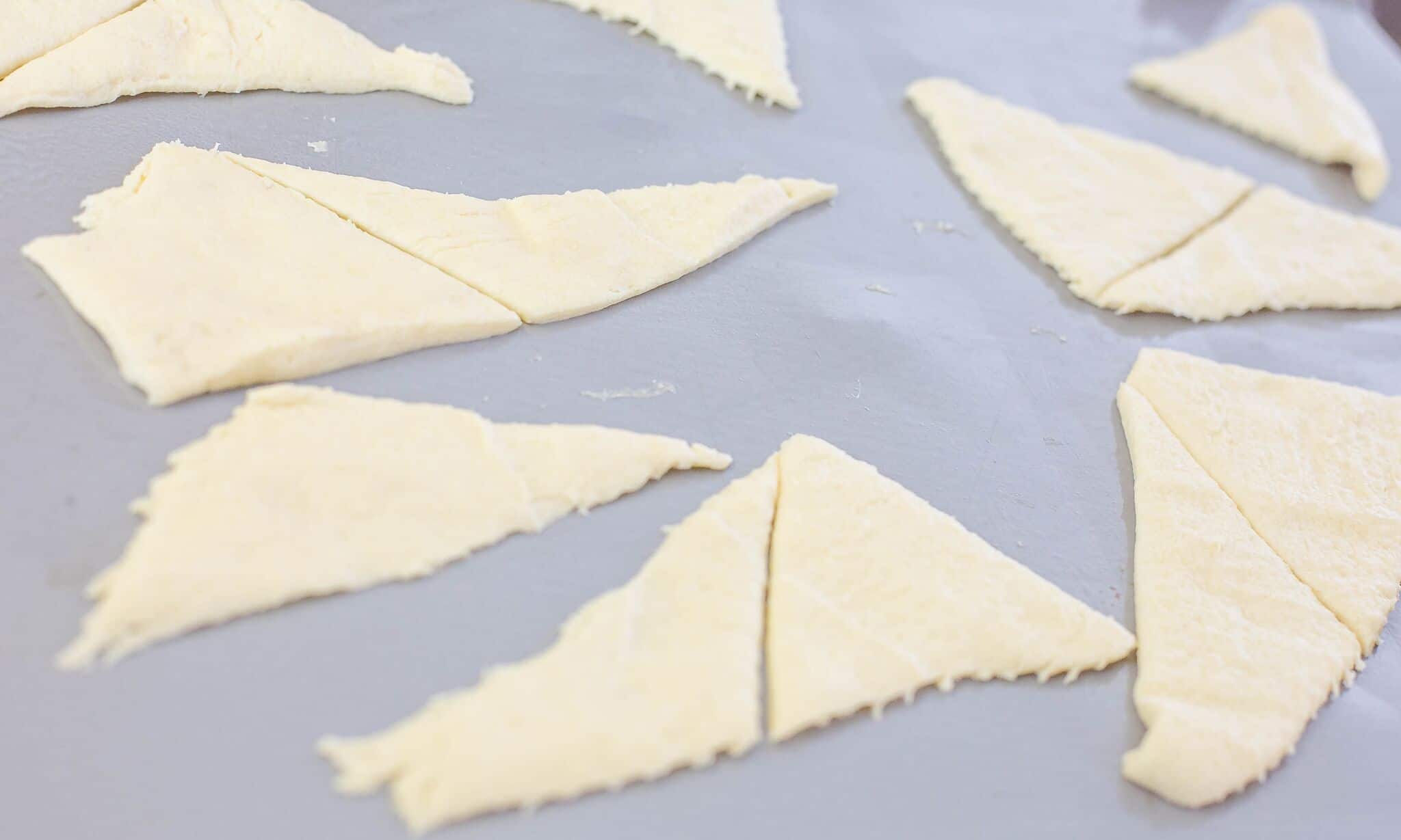 Unroll refrigerated crescents onto baking sheet 