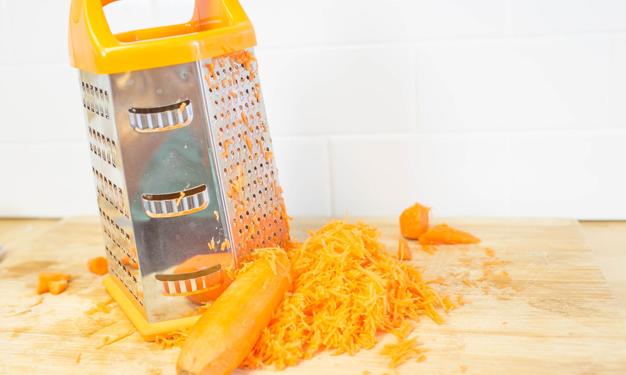 Peel and shred carrots, then set aside.