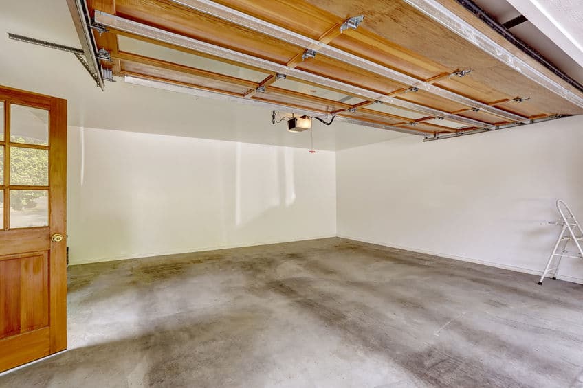 A clean garage with a concrete floor. 