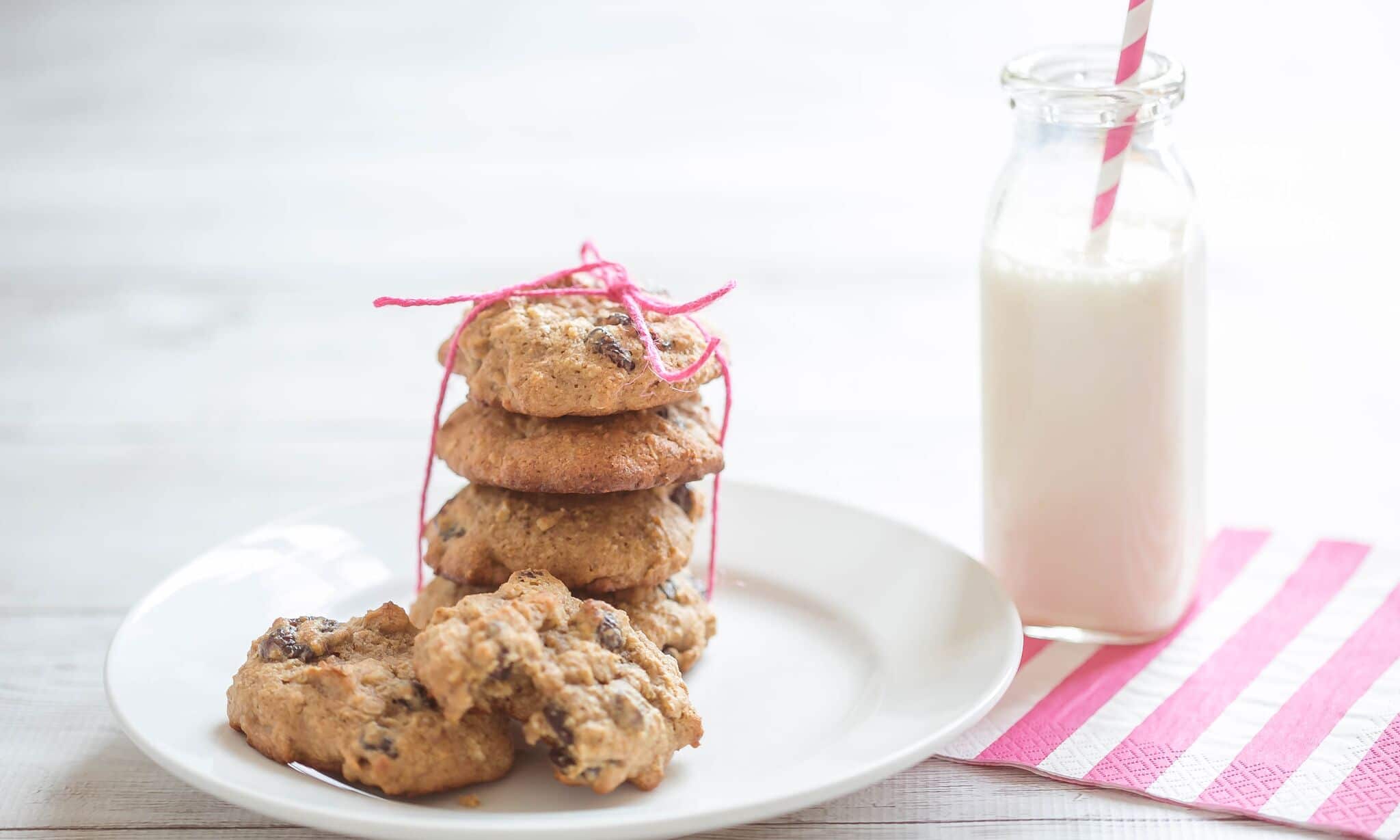 Serve cookies on plate with a glass of milk. 