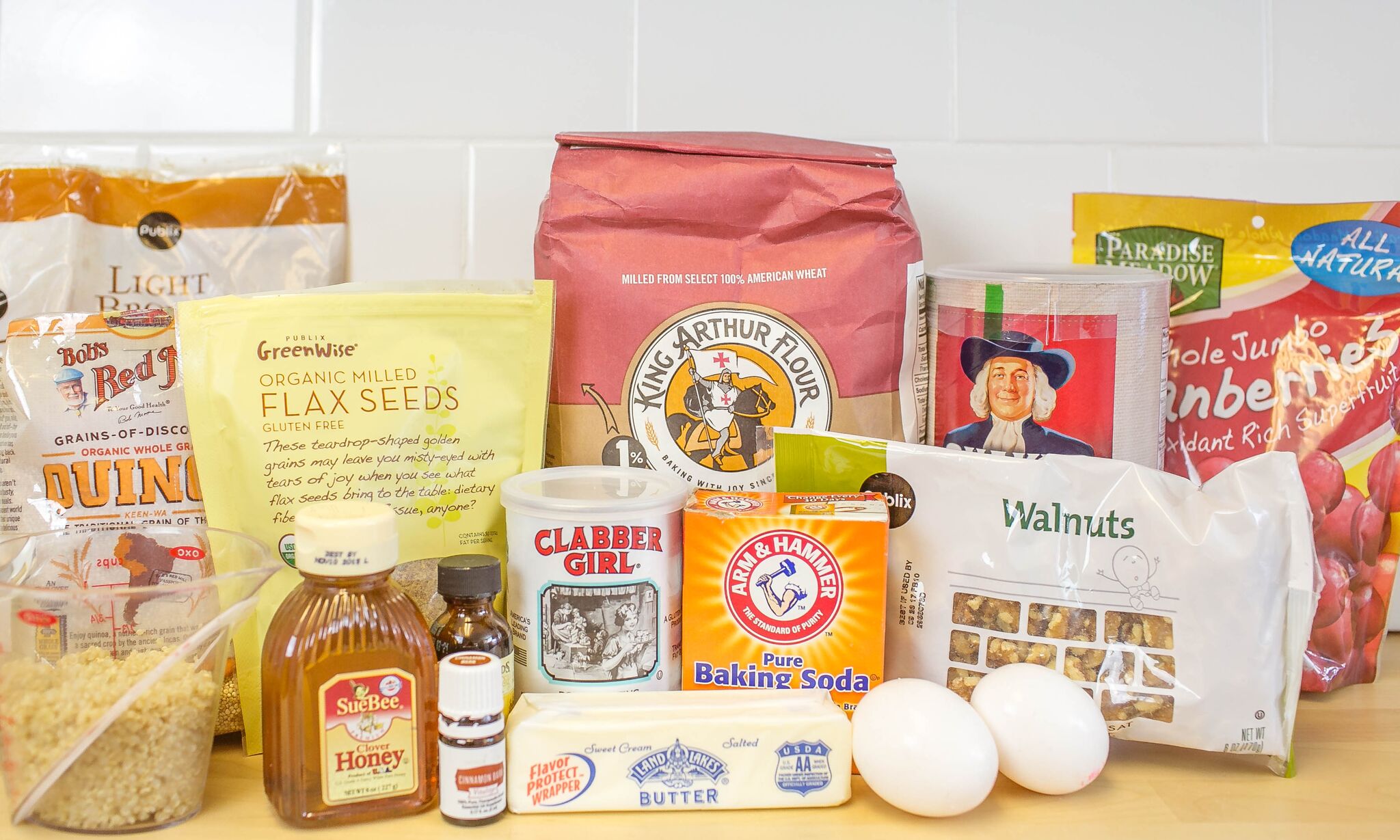 Assemble your ingredients: Whole wheat flour, rolled oats, quinoa, flaxseed meal, Cinnamon Bark Vitality&trade; or ground cinnamon, baking soda, baking powder, salt, butter, sugar, brown sugar, eggs, honey, vanilla extract, cranberries or raisins and walnuts. 