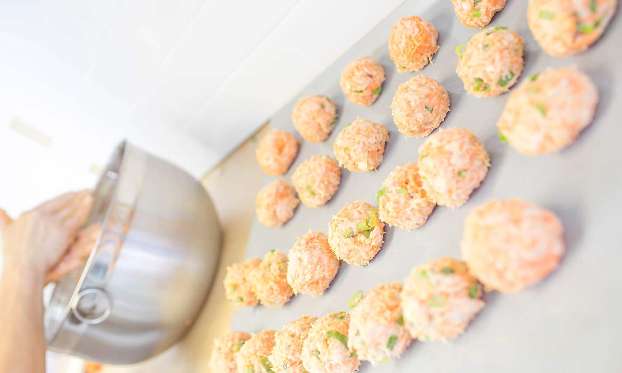 Use a tablespoon to spoon mixture and roll into meatballs.