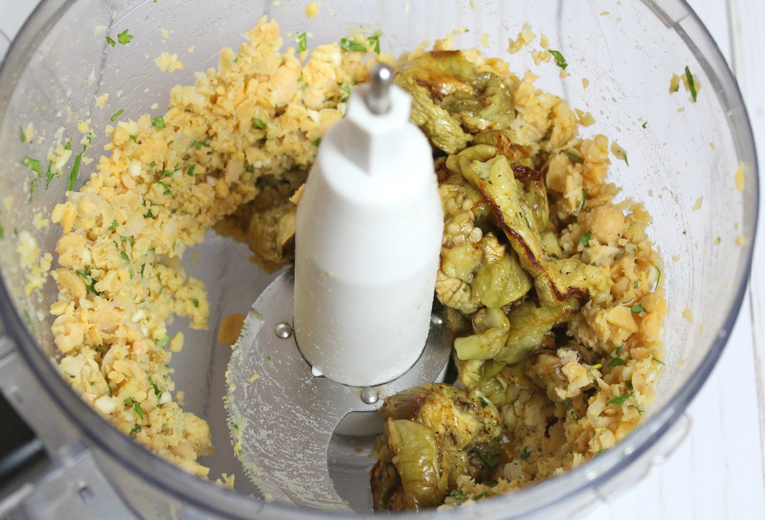 Add eggplant to food processor and blend for a few seconds. 