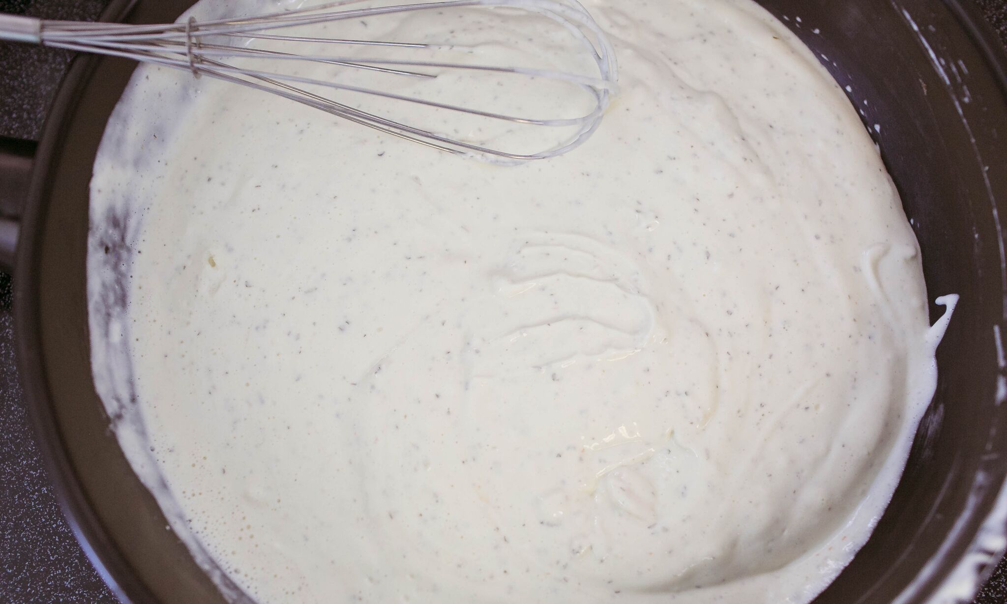 Add creamy cheese to saucepan and combine with mil using whisk. 