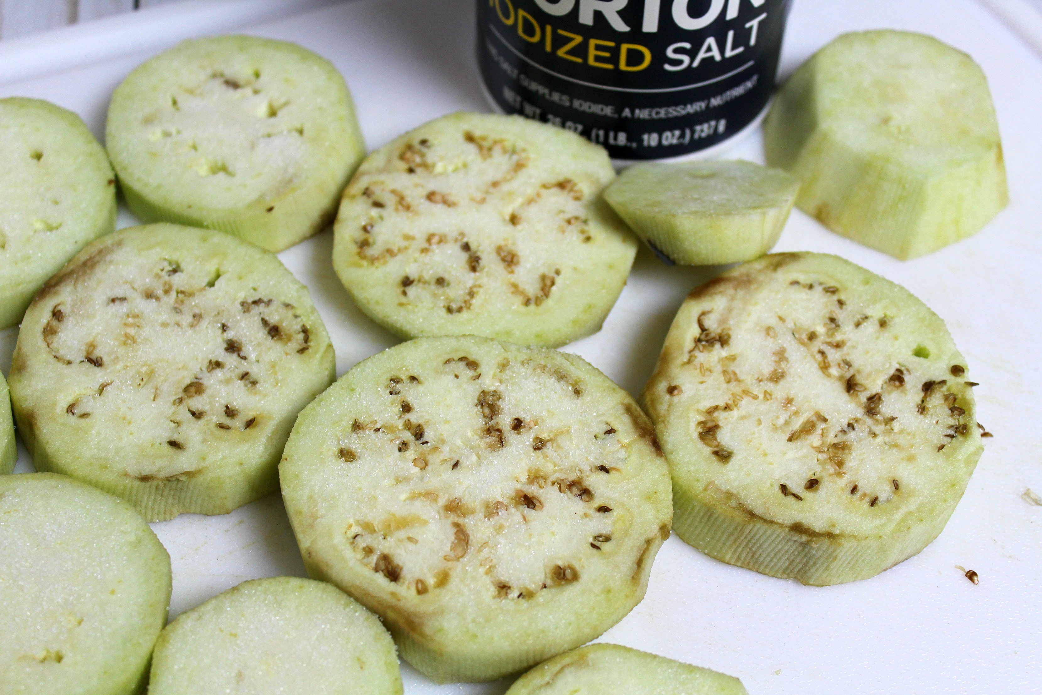 Sprinkle eggplant slices with salt and let sit for about 15 minutes. 