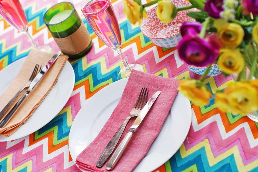 Pretty table decor and candles are great ways to add ambiance to your backyard party. 